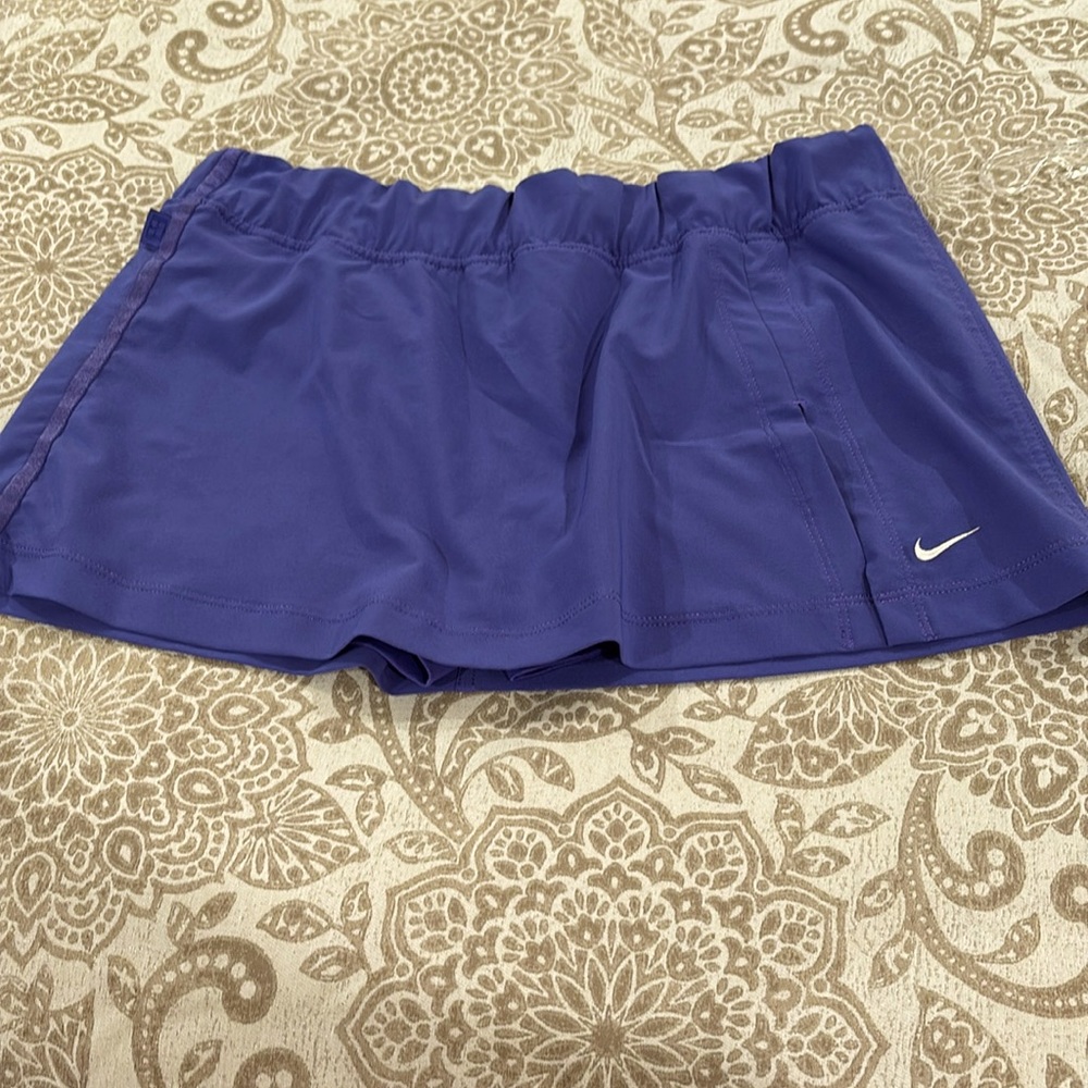 Cute Nike skirt with shorts underneath. Size M.